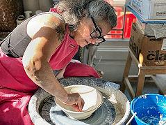 Isabelle Soulé works her potter�s wheel in her Eastmoreland art studio during this year�s Portland Open Studios.