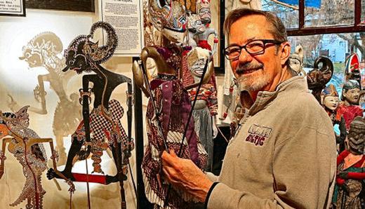 Portland Puppet Museum founder Steve Overton adjusts Sita, daughter of the Earth Mother, drawn from the epic poem The Ramayana  illustrated with puppets from India, Pakistan, and Bangladesh.