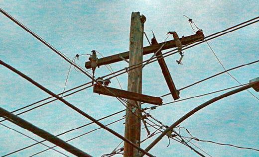 Although the heavy storm clouds overhead made it as dark as twilight in early afternoon, the PGE equipment failure is clearly visible at the top of this pole at Flavel and 60th in the Brentwood-Darlington neighborhood.