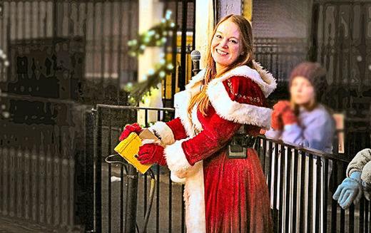 Dressed for the season  and, here, operating Oaks Parks Holiday-themed Herschell-Spillman Noah's Ark Carousel  its Amusement Park Rides Manager Celeste Walker.