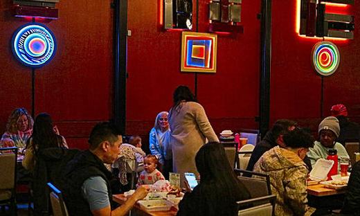 Inside Woodstocks The Heist Bar & Food Carts, illuminated art called Offset Circles - Humming Bird decorated the walls. 