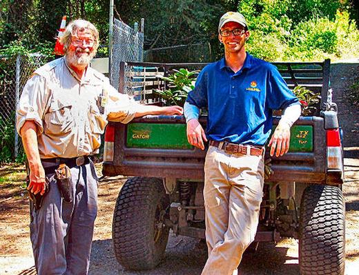 The Crystal Springs Rhododendron Garden�s Head Gardener, Frank Trees (left) joined volunteer Lincoln Proud in loading purchased plants, from the newly-revived Mother�s Day plant sale, for delivery to the buyers near the entry Gatehouse.