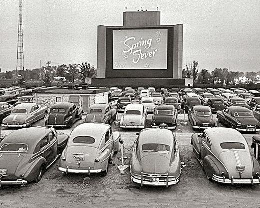 Americans couldn't wait until the opening of a new local Drive-In Theater. Opening night was often the busiest for theater owners, as this early photo of an unidentified Drive-In shows. The concession stand was usually located in the center of the theater�s lot, near the projector, for the easy access of the patrons.
