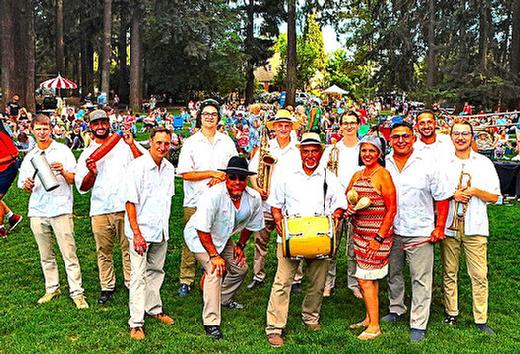 Just before turning to face the audience, and begin their July 15 concert in Sellwood Park, the Conjunto Alegre Latin Band said �hola� to THE BEE.