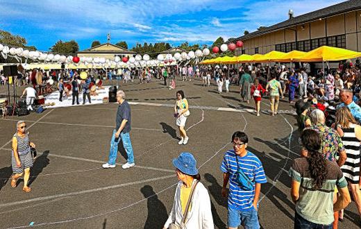 Near sunset at Obon Fest, these visitors were encouraged to participate in the traditional group dance  known as Bon Odori  in the courtyard of the Oregon Buddhist Temple, in Southeasts Creston-Kenilworth neighborhood.