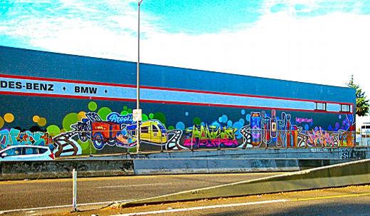 A look at the new Brooklyn Bound mural now completed on the north wall of Heckmann & Thiemann Motors, beside S.E. Powell Boulevard, at the east end of the railroad underpass between S.E. 19th and 21st Avenues.