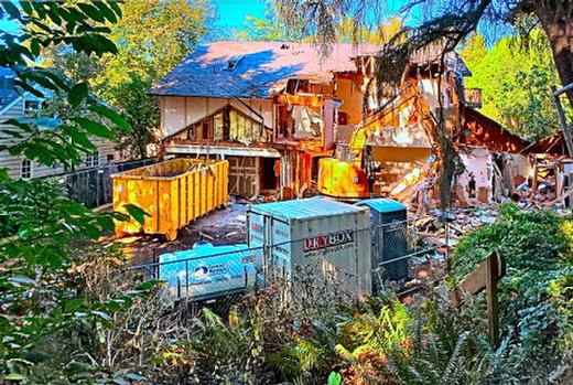 One bite at a time, this trashed and burned squatter house on Martins Street in Eastmoreland was dismantled. It was built thirty years ago as an Eastmoreland adult care home  but in recent years it had become a squatter hangout, the site of a major fire, and a major public nuisance.