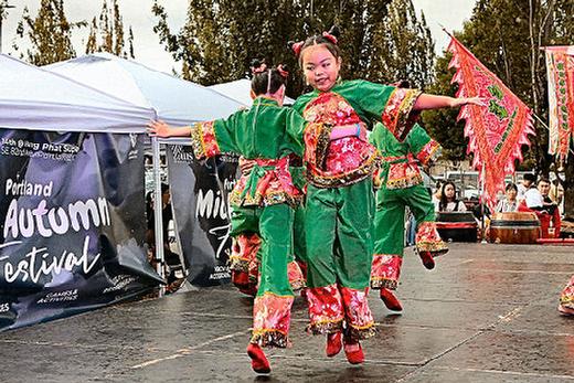 On stage, these young dancers entertained the audience during this years Mid-Autumn Moon Festival  which has this year moved to Eastport Plaza, at Holgate and S.E. 82nd Avenue of Roses.