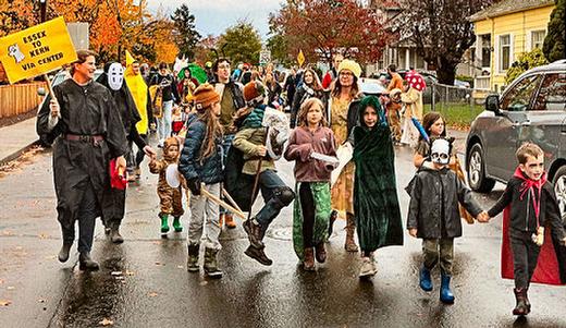 At far left, the parades organizer, Nicole Sisco, led the Foster-Powell Halloween Parade westward on S.E. Center Street.