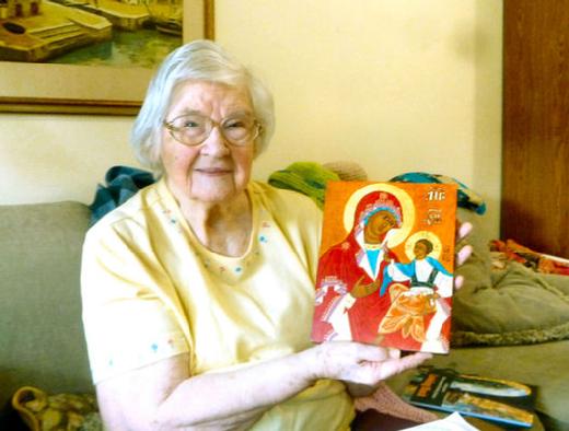 Freddi Haldors is here shown in her retirement apartment in Milwaukie in November of 2024. She is holding one of the early religious icons that she created.