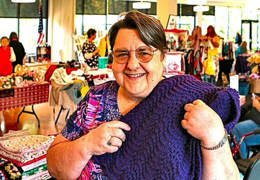 Barbara Johnson, a resident of Westmorelands Union Manor, and the organizer of this years craft sale, shows a knitted throw that she herself made, and she was selling at the fair.