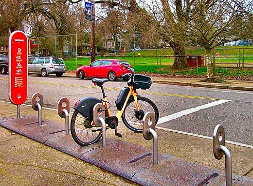 Portland�s �orange bike� rental system, �Biketown�, has been installed at S.E. Pershing Street and Milwaukie Avenue, across from Brooklyn Park.