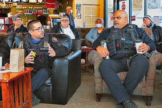 At this session of �Coffee with a Cop�, East Precinct Sergeant Craig Andersen (left) turned the discussion about shootings over to East Precinct Sergeant and acting-Lieutenant Michael Pool (at right).
