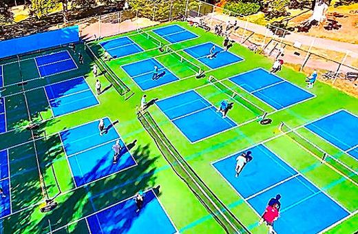 Although PP&R required that the this newly-refinished court in Sellwood Park also accommodate tennis players, this aerial view shows eight games of pickleball being played on it simultaneously.